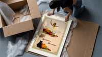 Vintage Halloween owl cat pumpkin framed print being unpacked from protective bubble wrap and a box