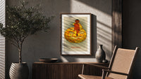 Red devil sitting on jack-o-lantern poster framed above a fluted sideboard beside an olive tree