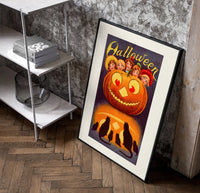 Vintage jack-o'-lantern with children's faces poster in a black frame leaning beside a shelf in a raw-plaster loft