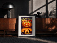 Black-framed Vintage jack-o'-lantern with children's faces print on a moody console with designer coffee-table books