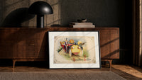 Vintage Halloween vegetable characters in car print in a black frame leaning against a walnut console in lamplight