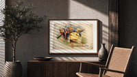 Vintage Halloween vegetable characters in car print in a wood frame above a fluted sideboard beside an olive tree