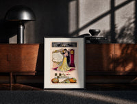 Black-framed Couple embracing beside grandfather clock print on a moody console with designer coffee-table books