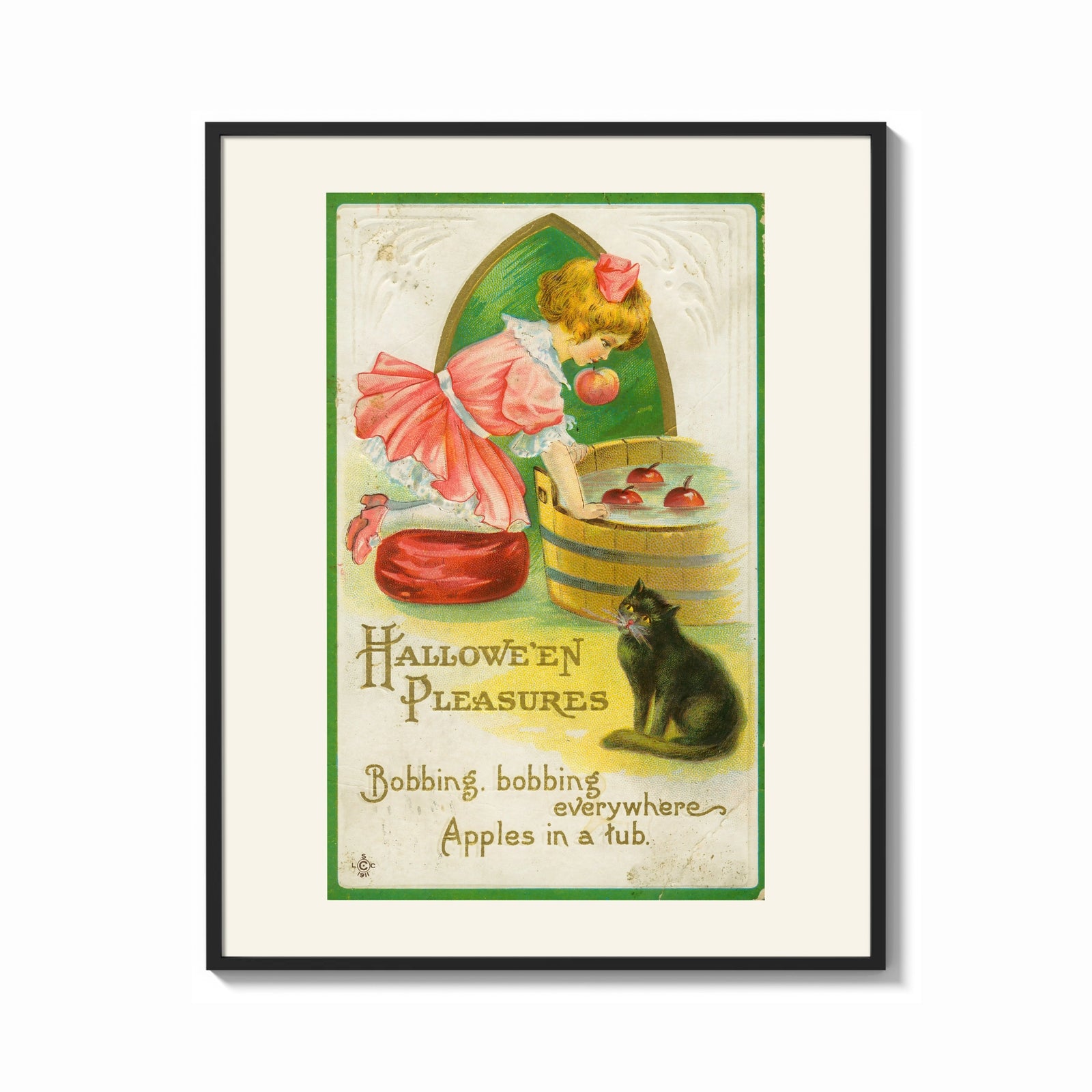 Framed Girl bobbing for apples with cat print shown as a bold statement piece on a clean gallery wall