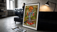 Pumpkin-headed woman in kimono print in a slim black frame leaning on a dark sofa in a concrete print studio