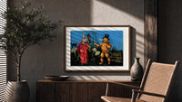 Witch and pumpkin man walking print in a wood frame above a fluted sideboard beside an olive tree