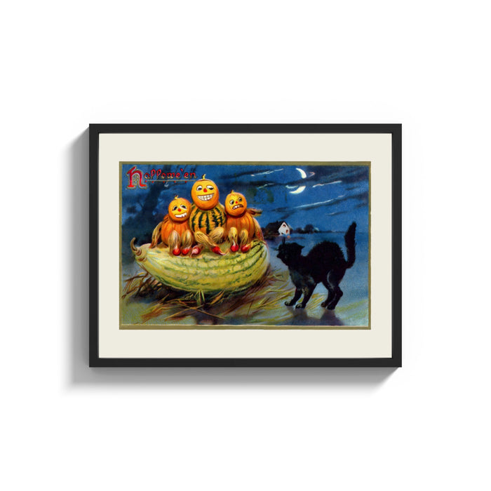 Framed Anthropomorphic pumpkin heads and black cat print shown as a wide statement piece on a clean white wall