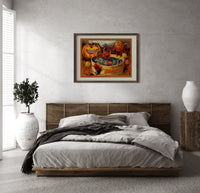 Anthropomorphic apples bobbing in tub print in a dark wood frame above a rattan bed on a plaster wall