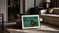 Witch flying on broom with black cat print in a slim black frame leaning on a travertine coffee table