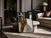Raised Wine Glass print on the floor, leaning against a travertine table