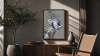 White Sneaker with Gold Chains poster framed above a fluted sideboard beside a potted tree