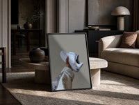 White Sneaker with Gold Chains print on the floor, leaning against a travertine table