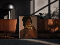 Black-framed Hand Holding Layered Chains print on the floor in front of a dark wooden console