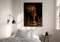 Hand Moving the Queen print in a black frame above a bed with striped linens, a brass wall lamp and a sunlit window