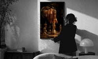 Hand Moving the Queen print in a slim black frame being hung on a sunlit wall in a monochrome room