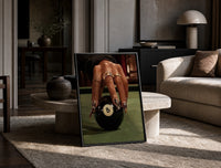 Hand on the Eight Ball print on the floor, leaning against a travertine table