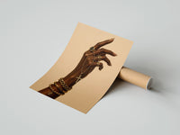 Gently curled Hand with a Cross and Gold Chains print beside its protective shipping tube