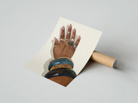 Gently curled Hand with Blue Bangles print beside its protective shipping tube