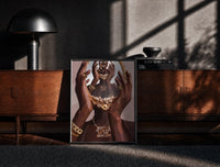 Black-framed Hands Holding an Ornate Mirror print on the floor in front of a dark wooden console