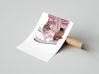 Gently curled Pink Low-Tops print beside its protective shipping tube
