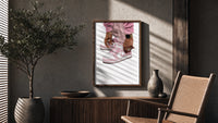 Pink Low-Tops poster framed above a fluted sideboard beside a potted tree