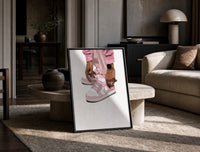 Pink Low-Tops print on the floor, leaning against a travertine table