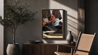 Hands with Rings and High-Top Sneakers poster framed above a fluted sideboard beside a potted tree
