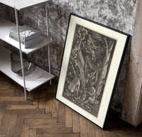 Nude witches with cauldron flying goat poster in a black frame leaning beside a shelf in a raw-plaster loft