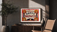 Halloween jack-o-lanterns and black cats print in a wood frame above a fluted sideboard beside an olive tree