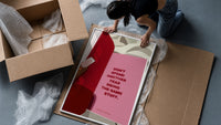 Healing Is a Journey Book Page framed print being unpacked from protective bubble wrap and a box