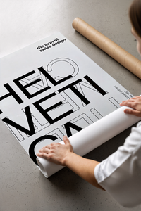 Helvetica Typography Swiss Design poster rolled beside its crush-resistant shipping tube