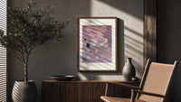 Abstract flower with swirls and circles poster framed above a fluted sideboard beside an olive tree