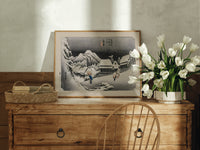 Snowy Japanese village travelers at night print in an oak frame on a farmhouse dresser beside white tulips