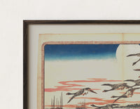 Close-up of the Flock of geese flying over bay print's dark wood frame corner and archival matte paper