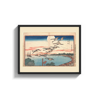 Framed Flock of geese flying over bay print shown as a wide statement piece on a clean white wall
