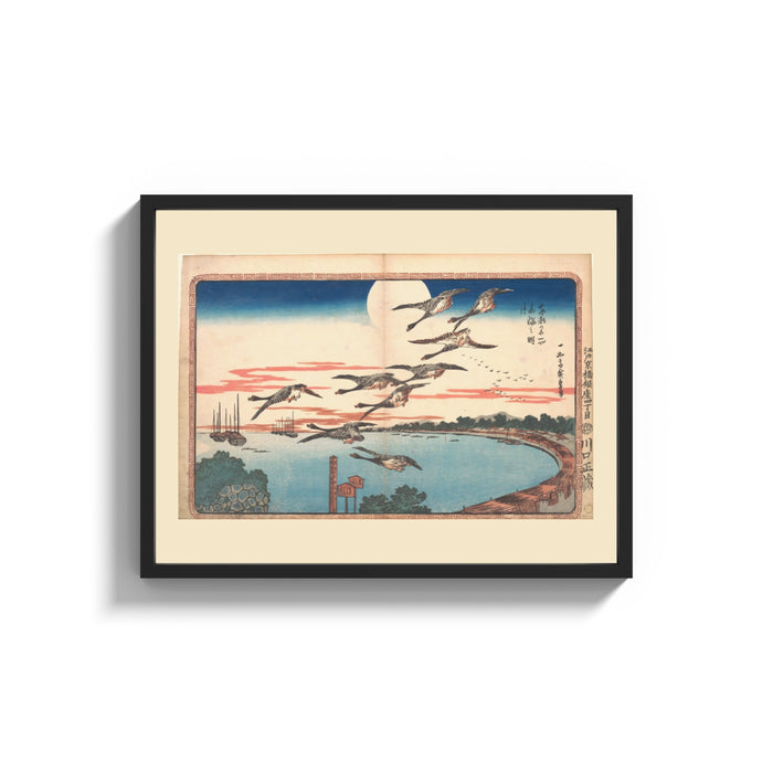 Framed Flock of geese flying over bay print shown as a wide statement piece on a clean white wall