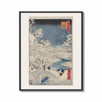 Framed Snowy bridge with travelers in winter print shown as a bold statement piece on a clean gallery wall
