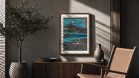 Women washing cloth by moonlit river poster framed above a fluted sideboard beside an olive tree