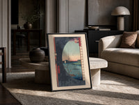 River landscape with plum blossom branch print in a black frame leaning on a travertine table in a sunlit lounge