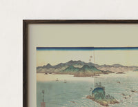 Close-up of the Japanese whirlpools and coastal seascape print's dark wood frame corner and archival matte paper