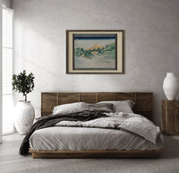 Mount Fuji reflected in water print in a dark wood frame above a rattan bed on a plaster wall