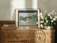 Mount Fuji reflected in water print in an oak frame on a farmhouse dresser beside white tulips