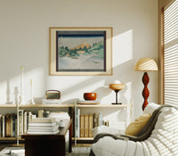 Mount Fuji reflected in water print in an oak frame above a mid-century book console with a vintage radio