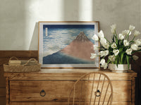 Mount Fuji with snow-capped peak print in an oak frame on a farmhouse dresser beside white tulips