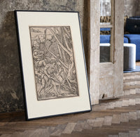 Adam laboring with skeleton Death figure print in a black frame leaning beside a vintage door on parquet