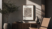 Adam laboring with skeleton Death figure poster framed above a fluted sideboard beside an olive tree