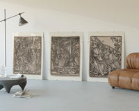 Death visiting medieval figures, three scenes three-panel set displayed beside a brown leather sofa