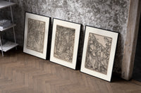 Death visiting medieval figures, three scenes set of three black-framed prints leaning against a raw-plaster wall