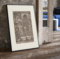 Skeletons dancing playing instruments print in a black frame leaning beside a vintage door on parquet