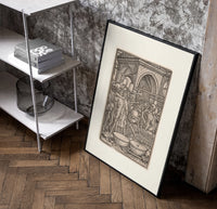 Skeletons dancing playing instruments poster in a black frame leaning beside a shelf in a raw-plaster loft